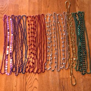 22 strands of Mardis Gras colored beaded necklaces
